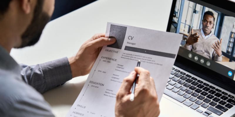 Online job interview; the recruiter looks at the resumé of a candidate. Sometimes, even after an interview there is ghosting in HR.